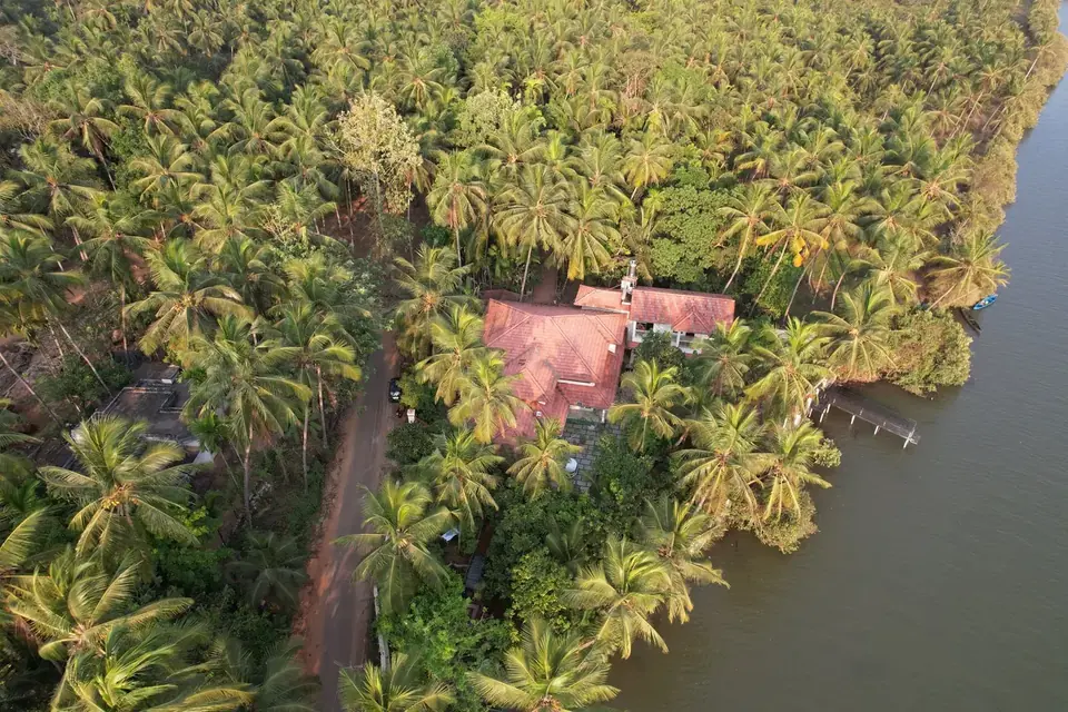 The villa in its coconut grove, BelleVue Riverside Villa, Kozhikode