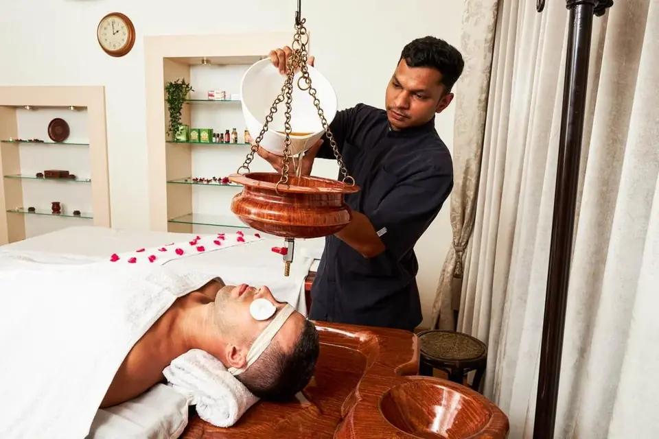Shirodhara therapy in the Ayurveda wellness program at BelleVue, Kozhikode