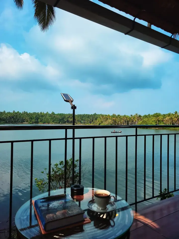 Breakfast table on a balcony with a view of the river
