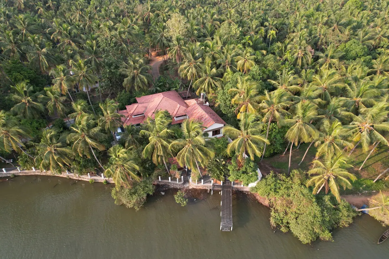 BelleVue Homestay on the riverbank, seen from the air