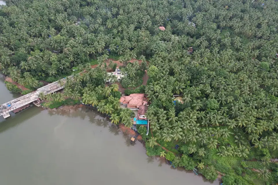 The Korapuzha riverbank, BelleVue Riverside Villa, Kozhikode
