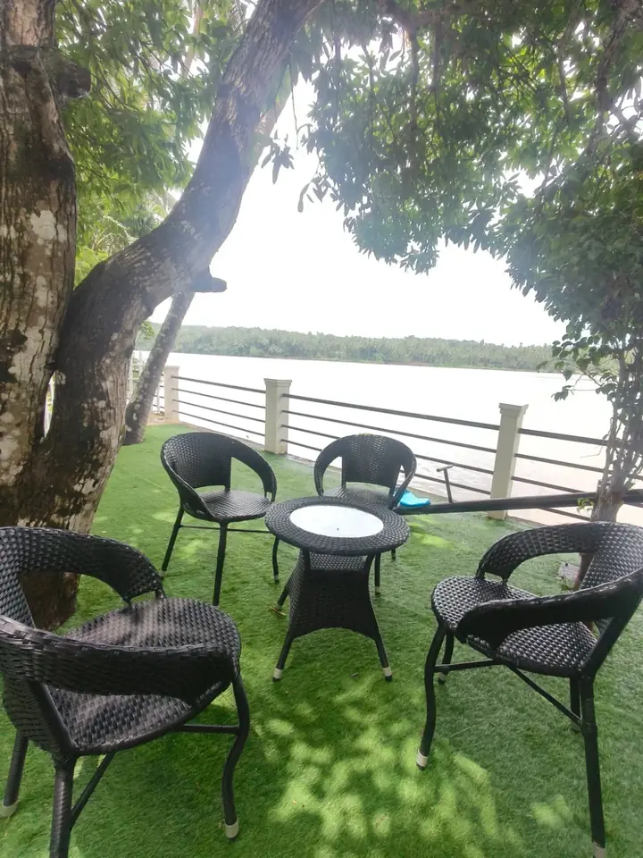 Garden seating by the river, BelleVue Riverside Villa, Kozhikode