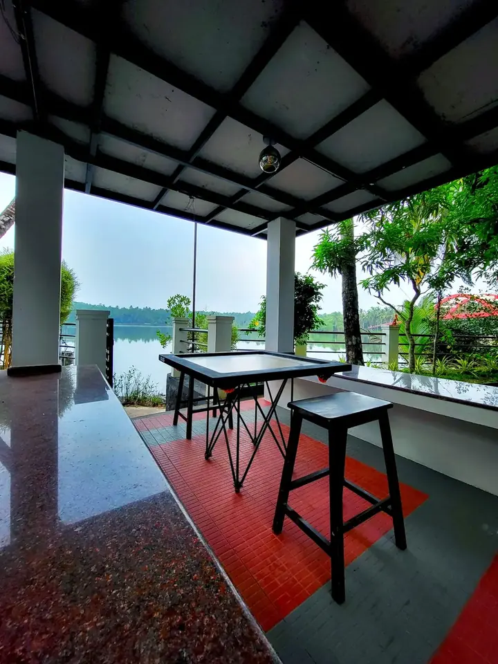 A table by the water, BelleVue Riverside Villa, Kozhikode