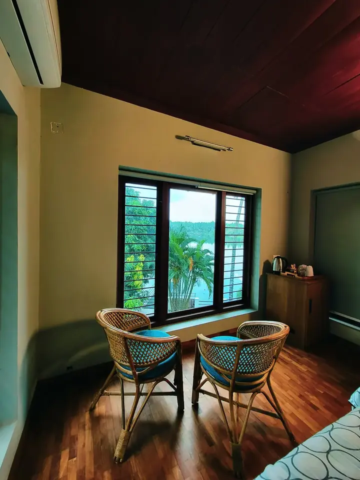 Chairs by the window, BelleVue Riverside Villa, Kozhikode