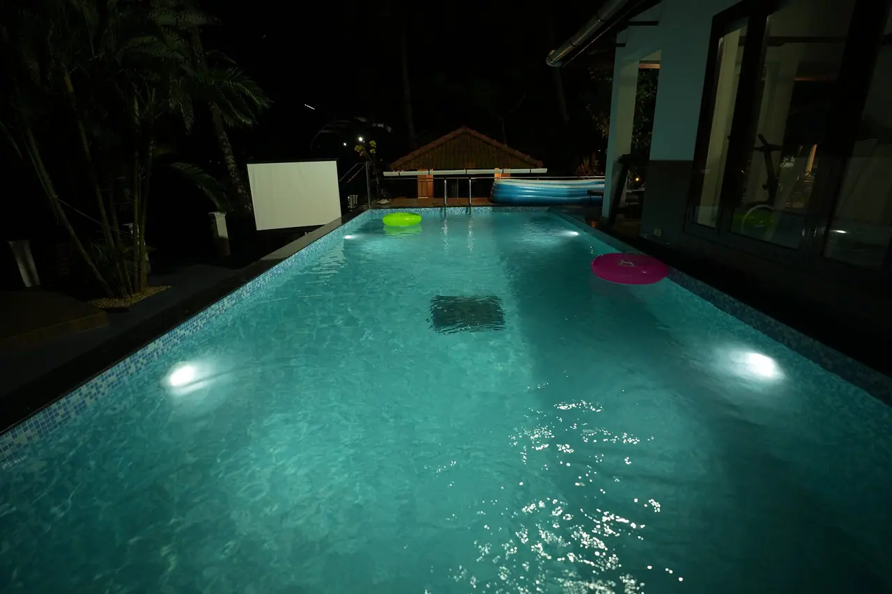 BelleVue swimming pool lit at night