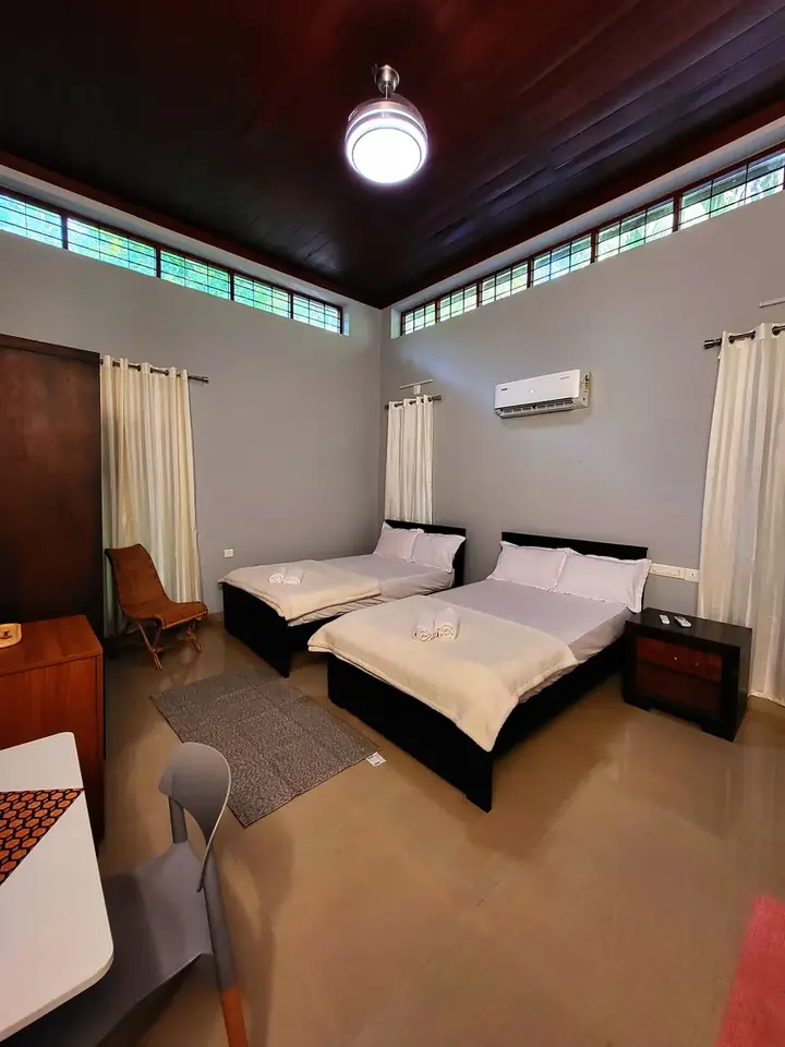 Twin Harmony Room at BelleVue with two single beds and air conditioning